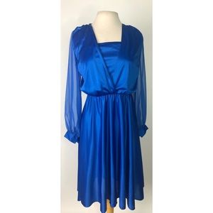 A vintage long sleeved dress with kick pleats